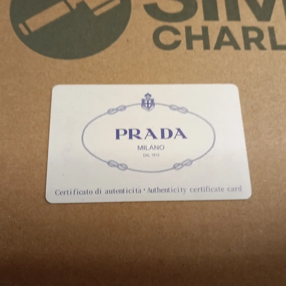 BOXED PAIR OF PRADA SUNGLASSES