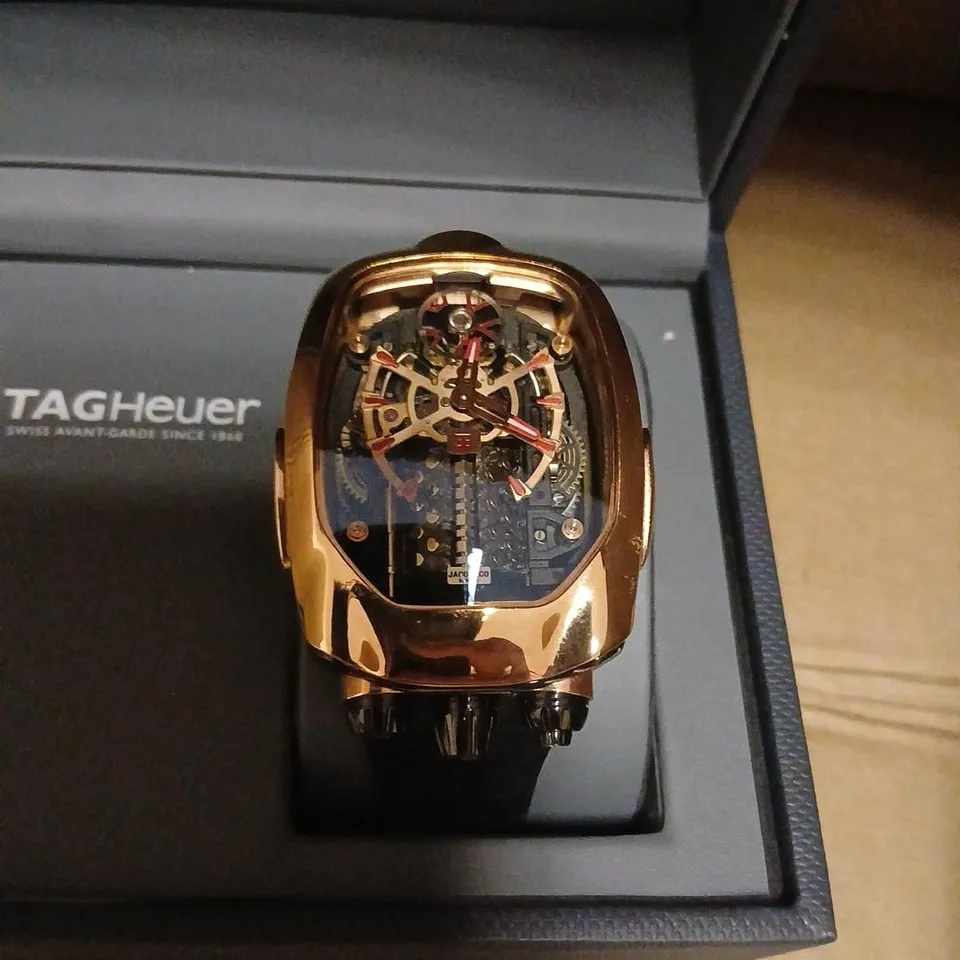 JACOB & CO SKELETON WATCH – ROSE GOLD TONE, SKELETON DIAL, BLACK STRAP