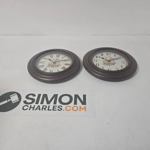PAIR OF ROUND WOODEN WALL CLOCKS WITH FLORAL CENTRE DIAL