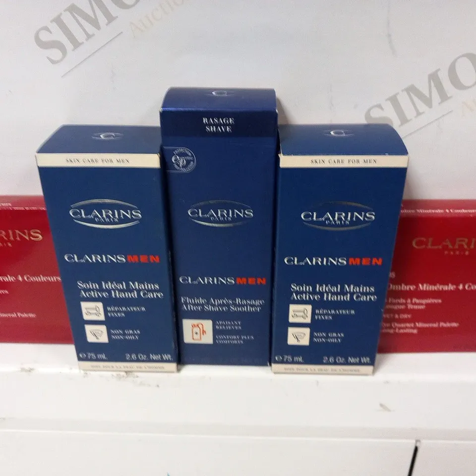 APPROXIMATELY 41 ASSORTED CLARINS PARIS COSMETICS PRODUCTS TO INCLUDE; AFTER SHAVE SOOTHER, ACTIVE HAND CARE, EYE QUARTET MINERAL PALETTE, INSTANT SMOOTH FOUNDATIOIN AND TREATMENT FRAGRANCE