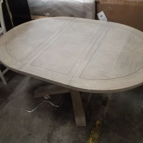 ROUND EXTENDABLE DINING TABLE