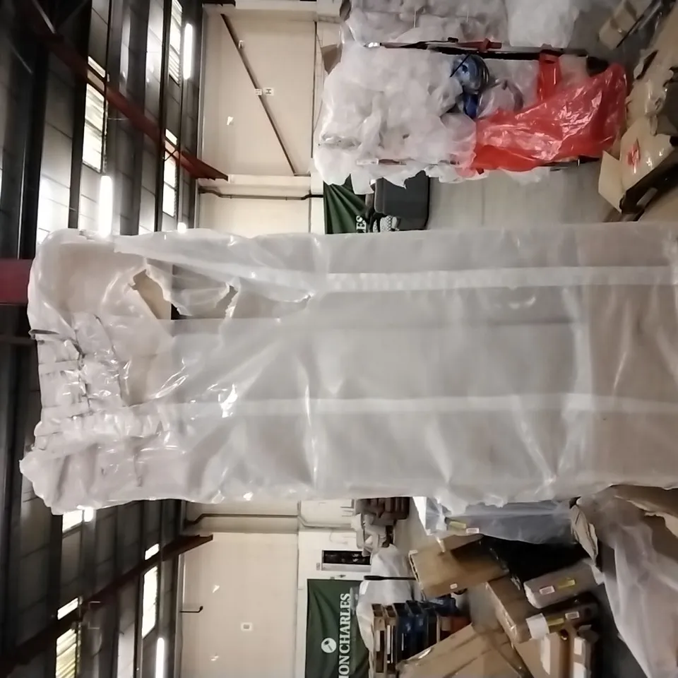 BAGGED 135CM BED BASE IN CREAM,  ONE PART MISSING 