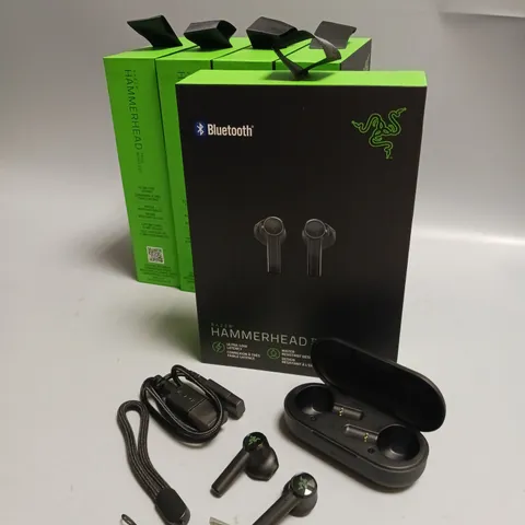 LOT OF 5 BOXED RAZER WIRELESS HEADPHONES IN BLACK AND GREEN INCLUDES CHARGING CASE, CABLE AND WRIST STRAP