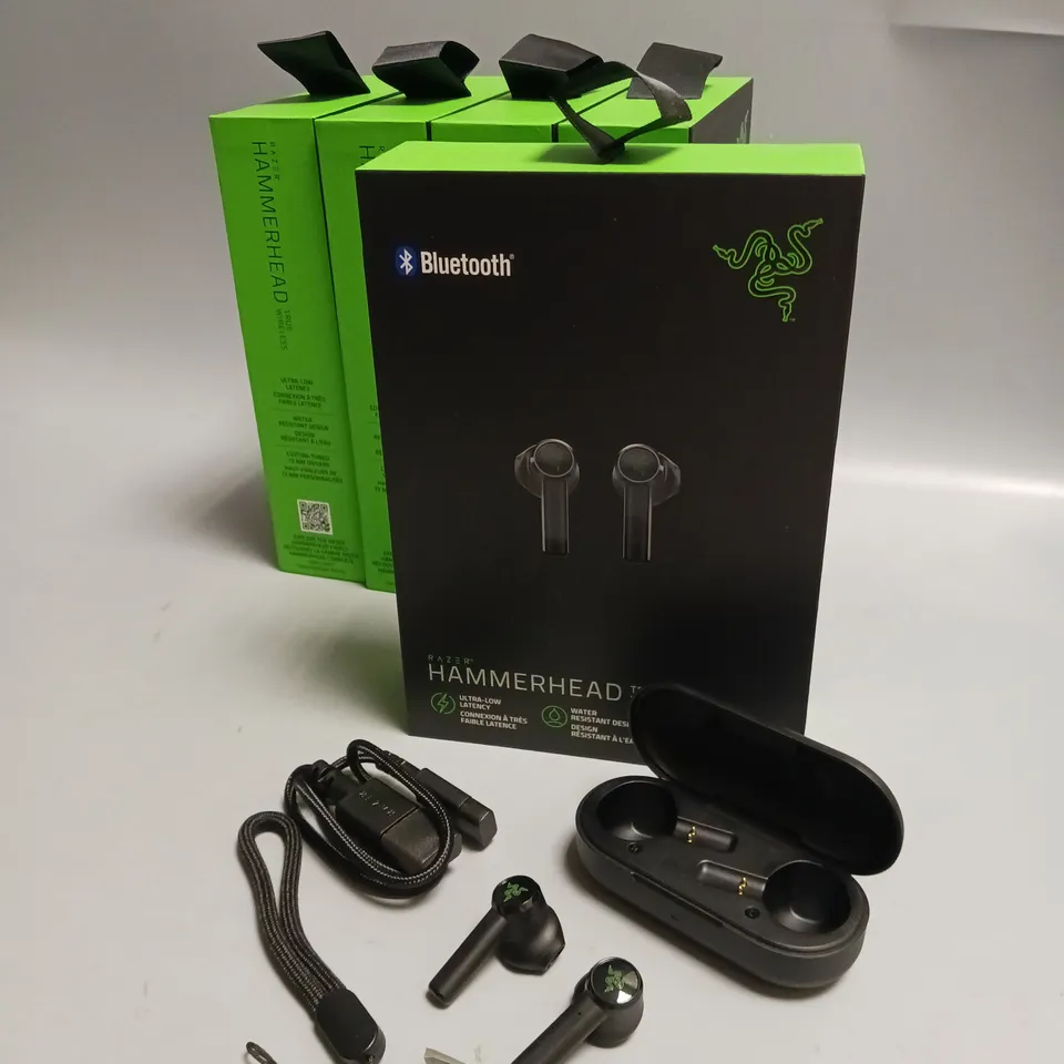 LOT OF 5 BOXED RAZER WIRELESS HEADPHONES IN BLACK AND GREEN INCLUDES CHARGING CASE, CABLE AND WRIST STRAP