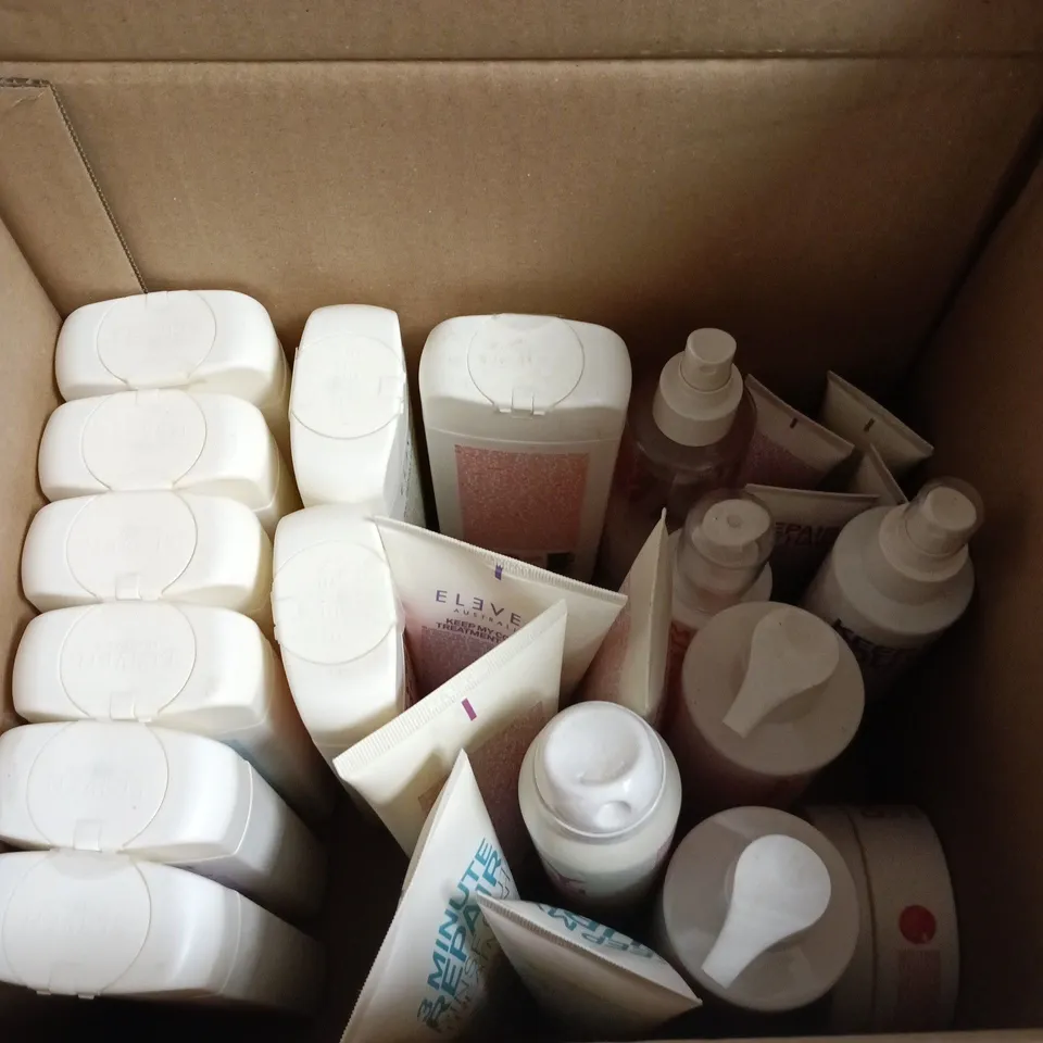 BOX OF APPROXIMATELY 25 ELEVEN HAIRCARE PRODUCTS TO INCLUDE 3 MINUTE REPAIR TREATMENT, DEEP CLEAN CLARIFYING SHAMPOO AND I WANT BODY VOLUME FOAM