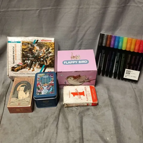 APPROXIMATELY 12 ASSORTED TOYS & GAMES PRODUCTS TO INCLUDE OUTLINE MARKERS, TAROT CARDS, DEFORMATION CAR SERIES TOY, ETC