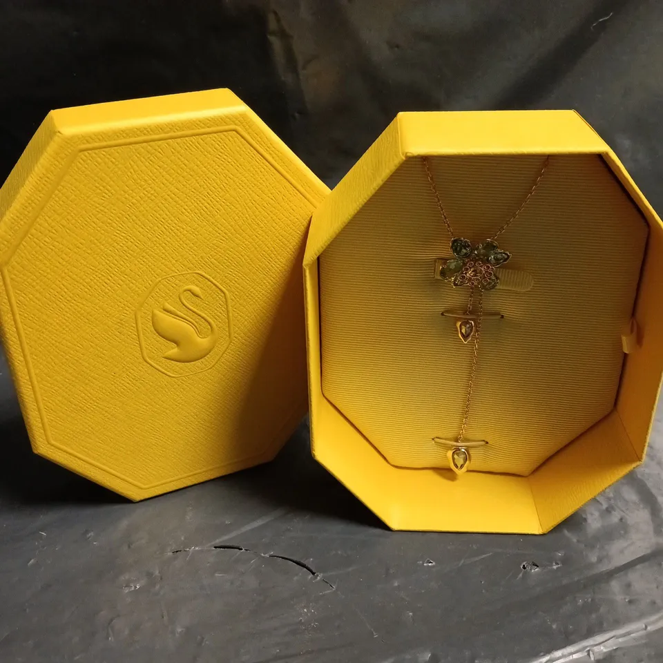 SWAROVSKI FLORAL PENDANT NECKLACE WITH GREEN STONES AND PINK CENTRE