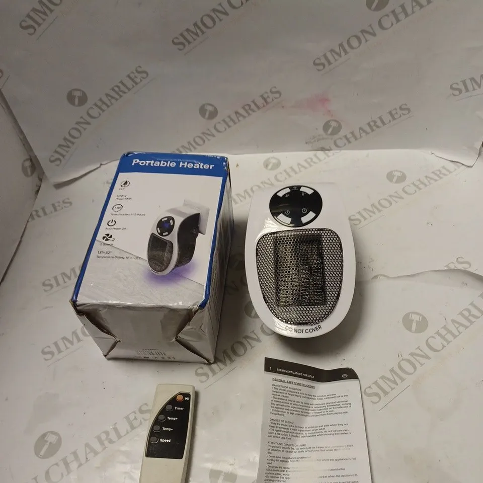 BOXED PORTABLE 500 WATT ELECTRIC HEATER WITH REMOTE CONTROL AND INSTRUCTIONS 