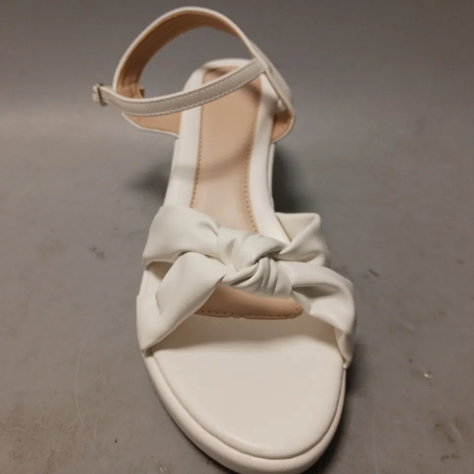 BOXED PAIR OF DESIGNER OPEN WEDGE SANDALS IN WHITE EU SIZE 40