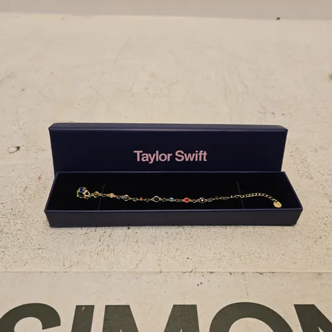 TAYLOR SWIFT COLOURFUL GEM BRACELET – GOLD-TONE WITH MULTICOLOUR STONES (BOXED)