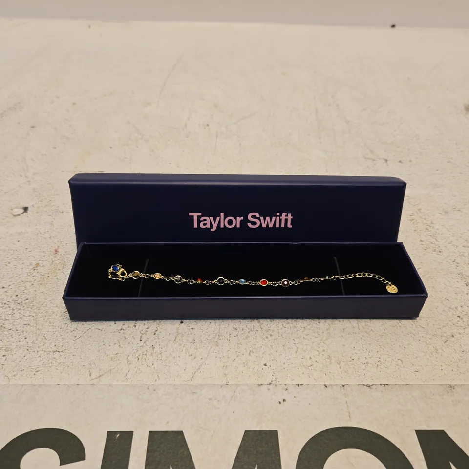 TAYLOR SWIFT COLOURFUL GEM BRACELET – GOLD-TONE WITH MULTICOLOUR STONES (BOXED)
