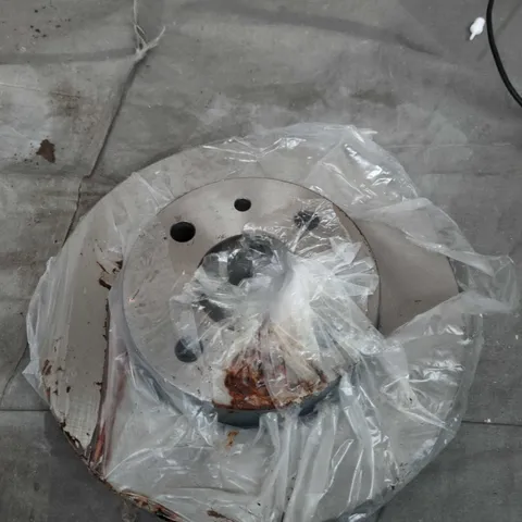 Vehicle brake rotor disc – rusted with central hub and bolt holes 