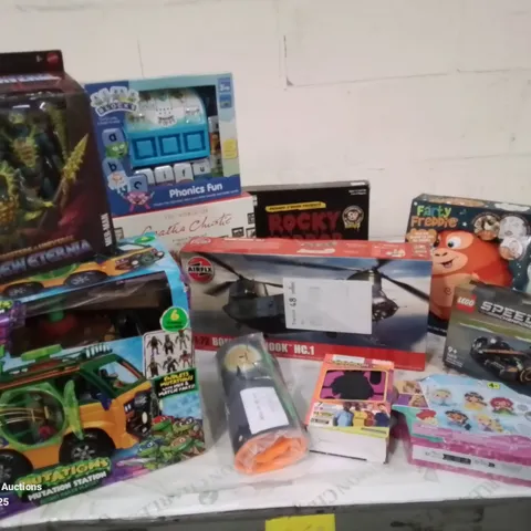 BOX CONTAINING APPROXIMATELY 10 TOYS TO INCLUDE: TURTLES PLAYBUS SET, 2025 FOOTBALL CARDS, CHINOOK MODEL, ROCKY HORROR SHOW GAME,  LEGO MCLAREN ETC.