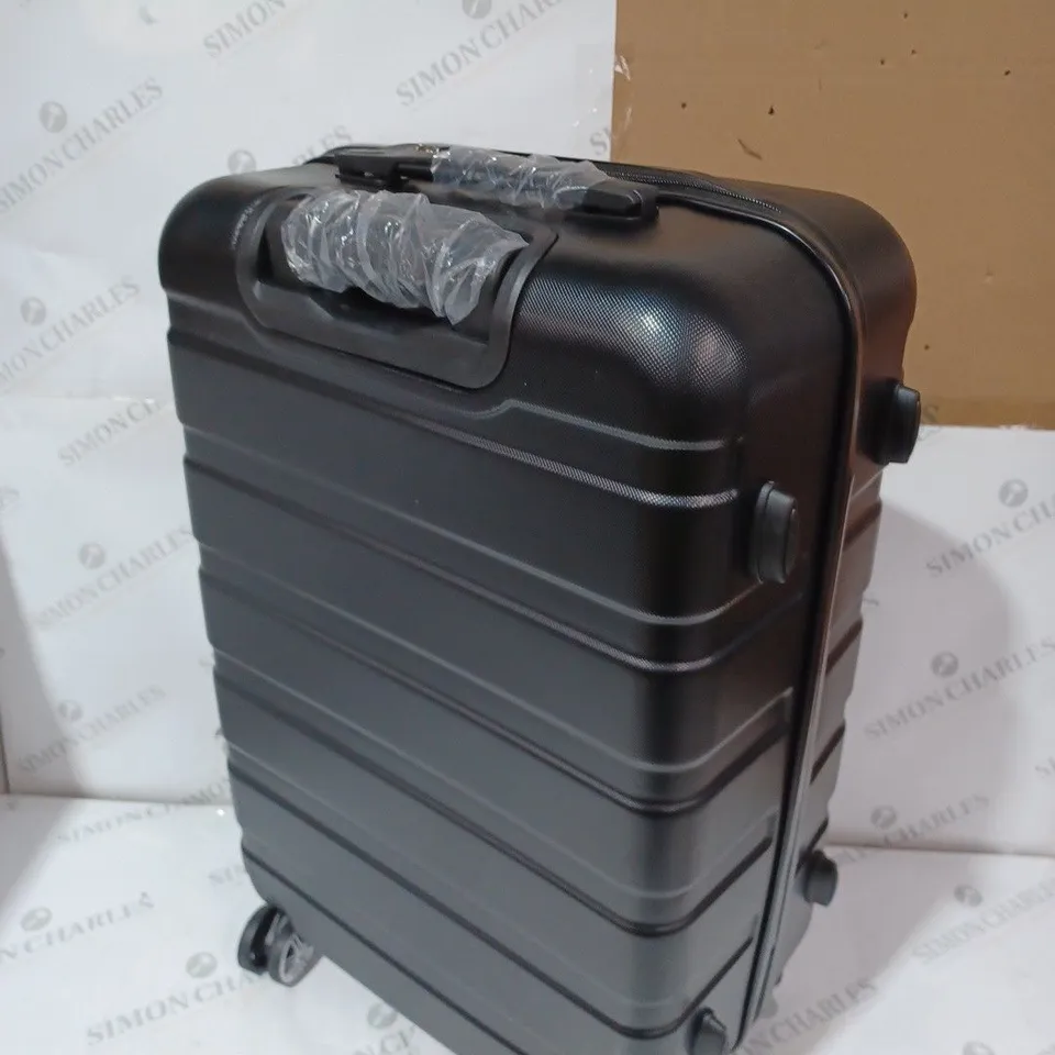 BOXED DESIGNER BLACK HARD SHELL WHEELED SUITCASE - CAPACITY UNSPECIFIED 