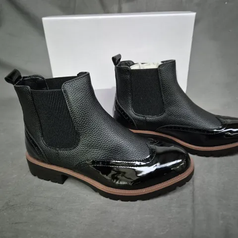 BOXED PAIR OF BLACK SLIP ON BOOTS SIZE 37 