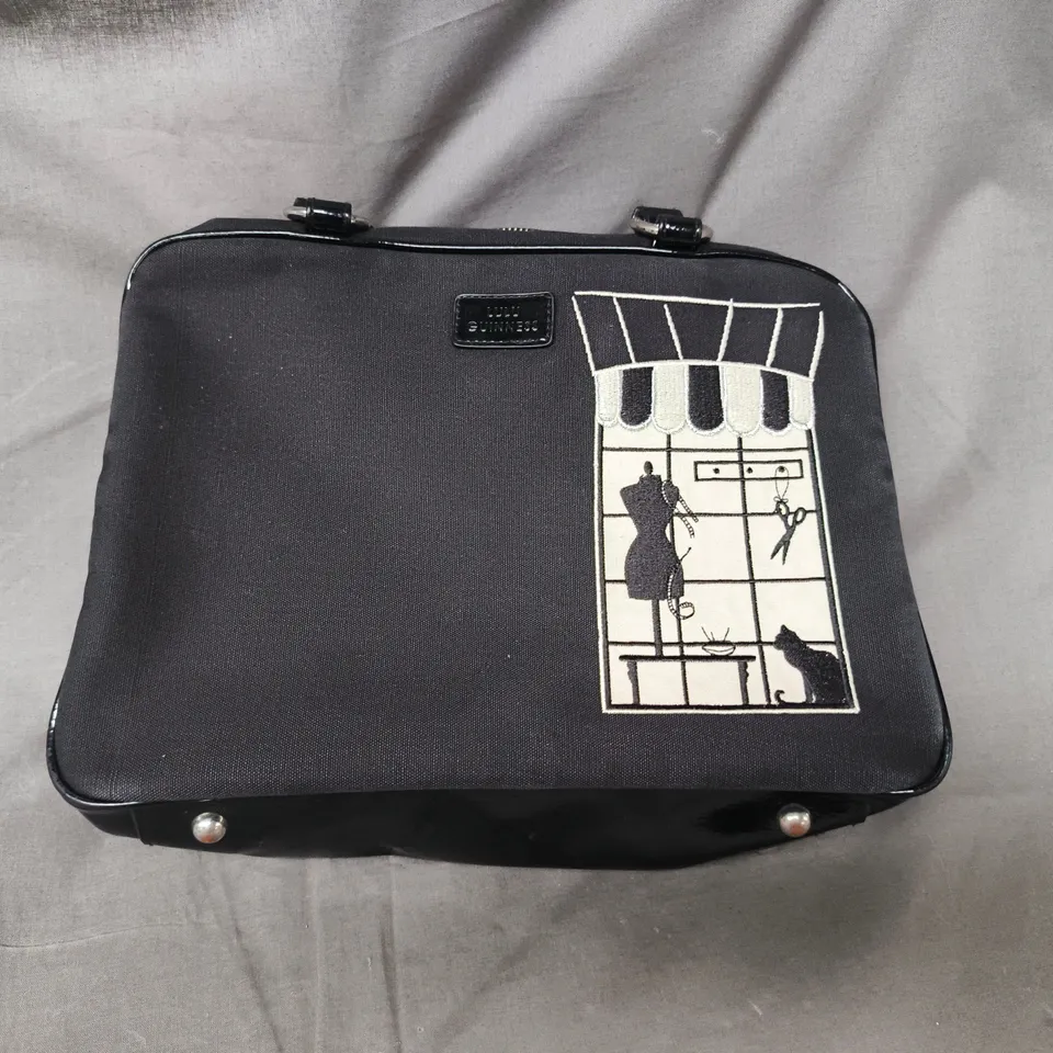 LULU GUINNESS HANDBAG – STOREFRONT PRINT, BLACK EXTERIOR WITH RED LINING