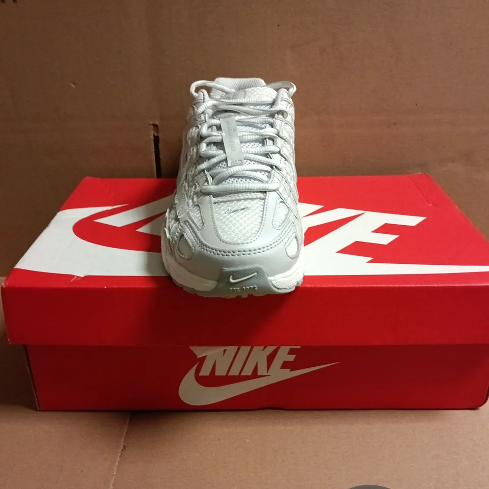 BOXED PAIR OF NIKE P-6000 TRAINERS IN WHITE SIZE UK 4