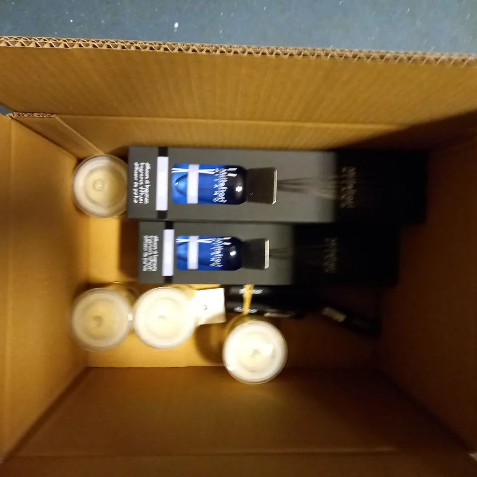 BOX OF APPROX 10 ITEMS INCLUDING MILLEFIORI REED DIFFUSERS, COLONY SCENTED CANDLE AND FLORMAR HIGHLIGHT STICK