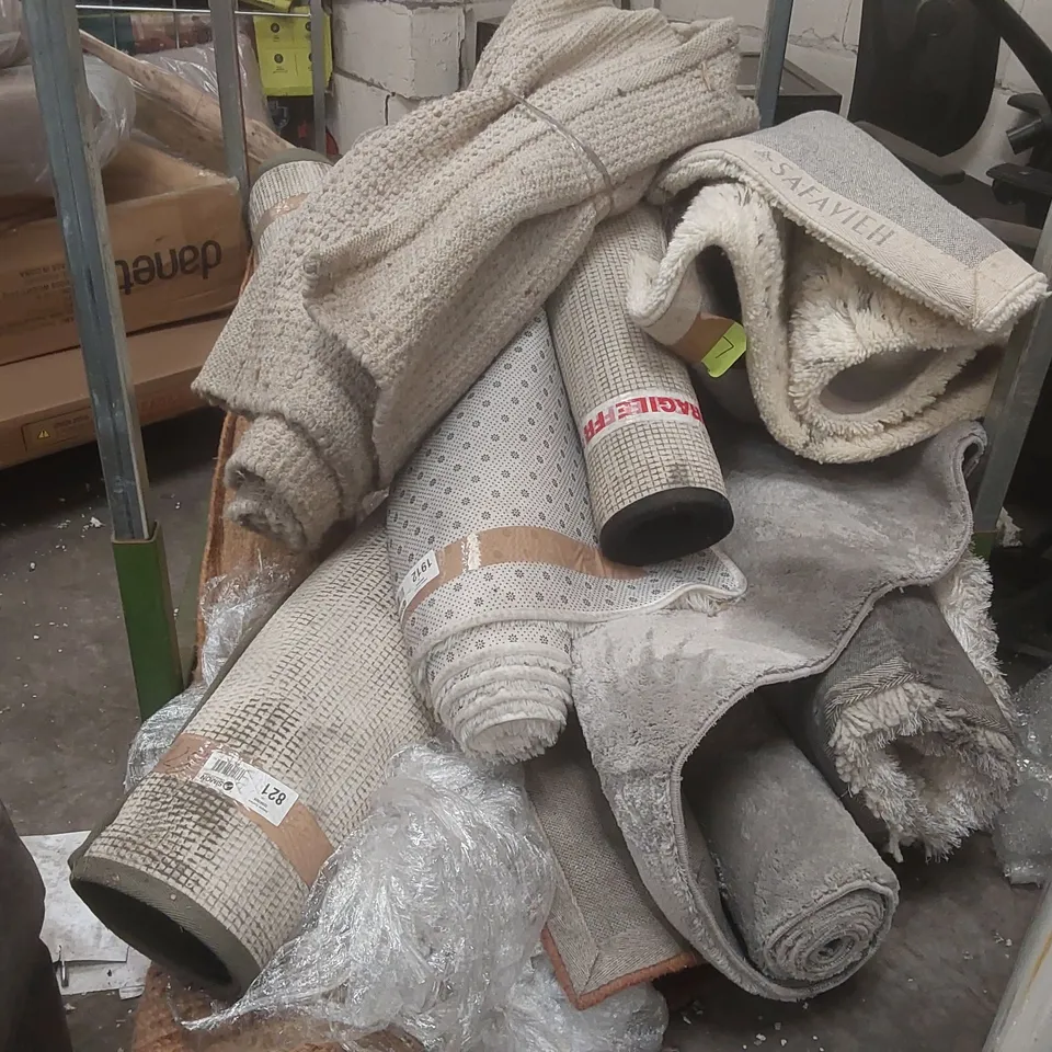 STILLAGE CONTAINING A VERY LARGE QUANTITY OF ASSORTED DESIGNER RUGS // STILLAGE NOT INCLUDED