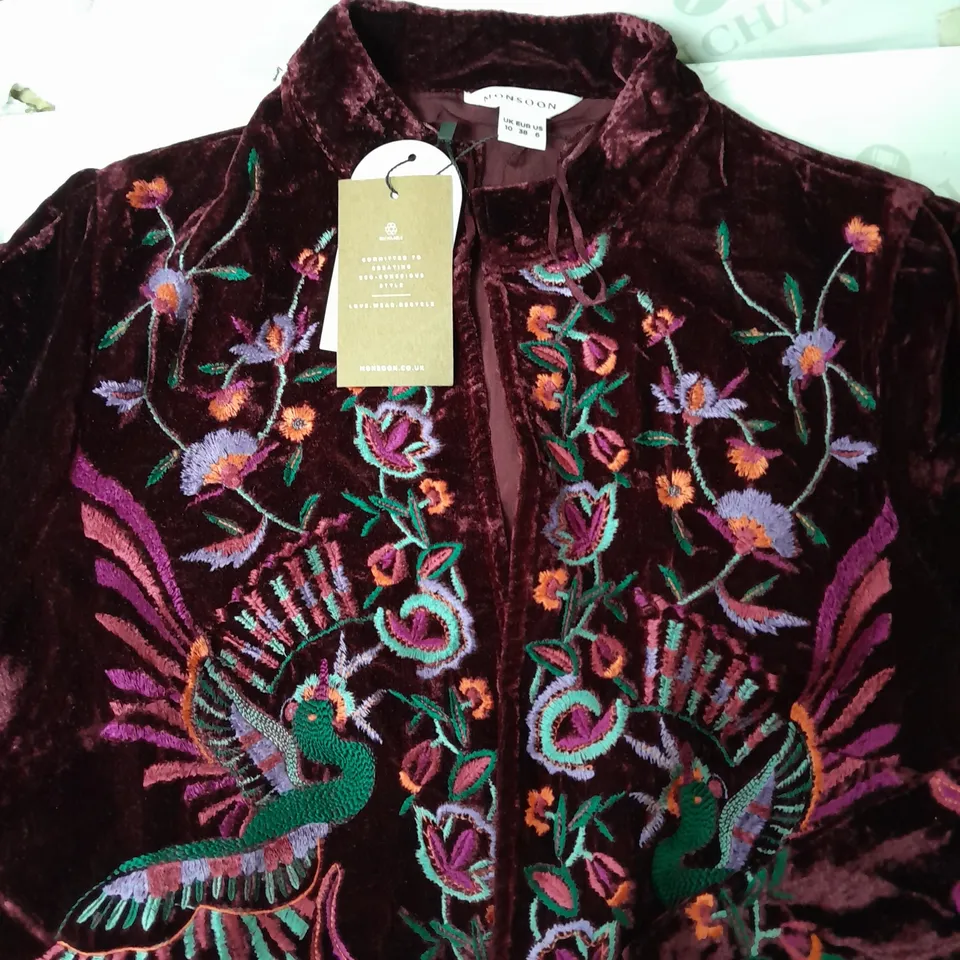 A BOX OF 10 CLOTHING ITEMS TO INCLUDE A PURPLE TOP A BROWN PAIR OF STRETCHY TROUSERS AND A ORIENTAL STYLE VELVET EFFECT JACKET WITH PEACOCK DESIGN 