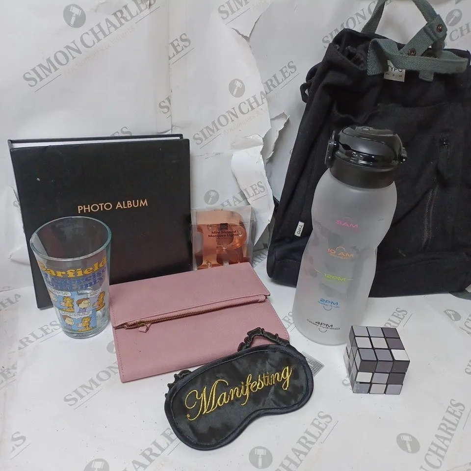 APPROXIMATELY 4 COTTON ON ITEMS INCLUDING PHOTO ALBUM, SLEEP MASK, BLACK BACKPACK