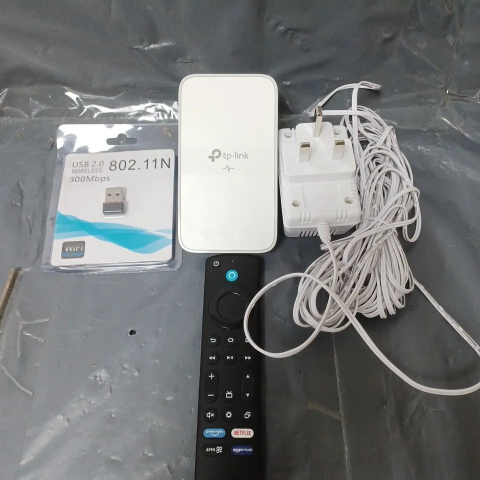BOX OF APPROXIMATELY 15 ASSORTED ELECTRICXAL ITEMS TO INCLUDE REMOTE CONTROLS , CABLES AND PLUGS