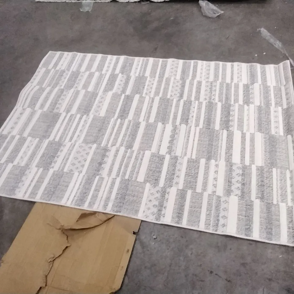 STILLAGE OF APPROXIMATELY 22 DESIGNER RUGS
