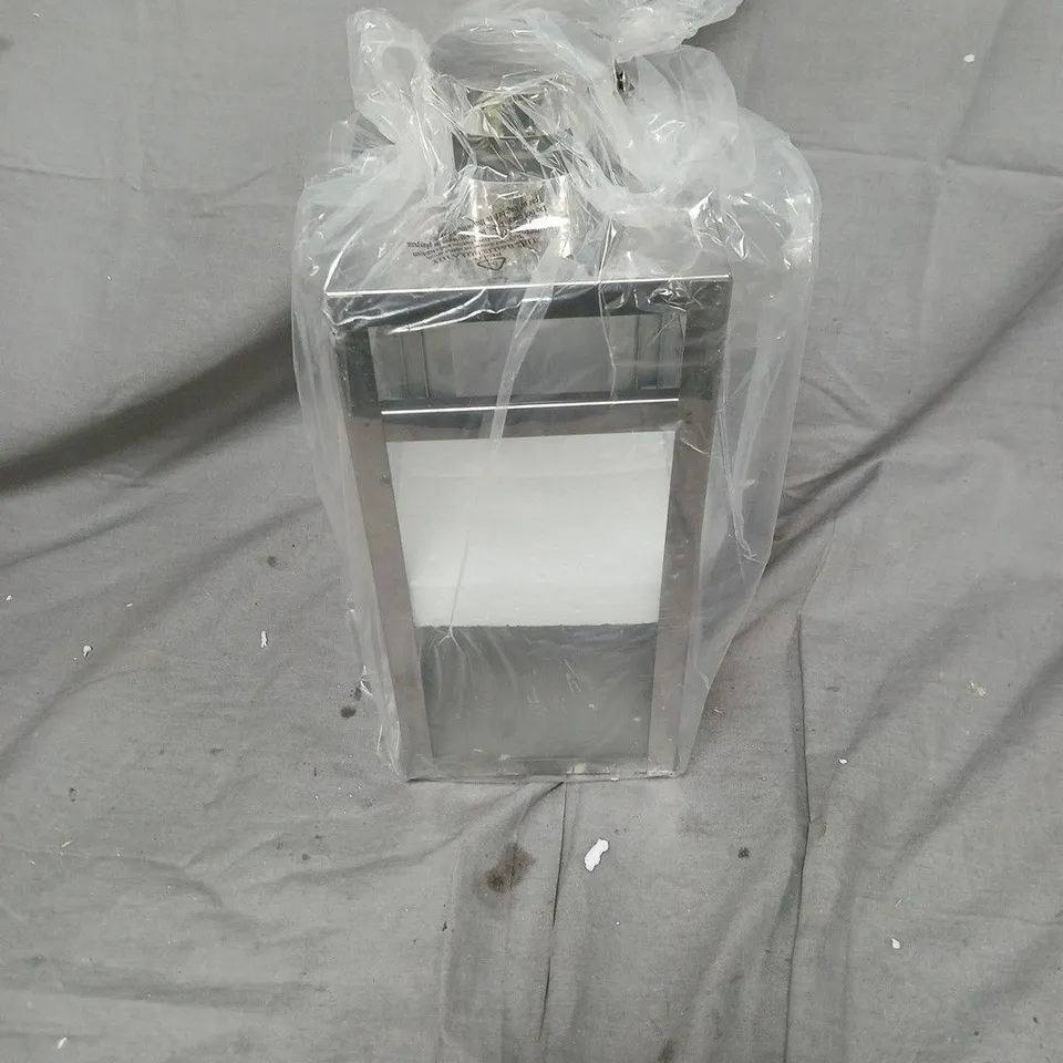 METAL AND GLASS LANTERN, WRAPPED IN PROTECTIVE PLASTIC