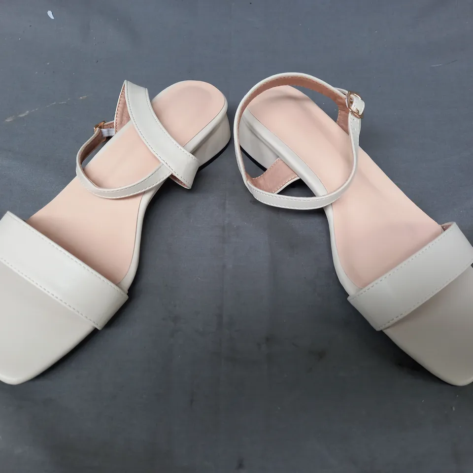 BOXED PAIR OF DESIGNER OPEN TOE LOW HEEL SANDALS IN CREAM EU SIZE 38