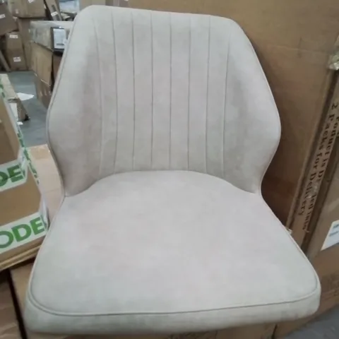 A BOXED PAIR OF CREAM FAUX LEATHER UPHOLSTERED SIDE CHAIRS