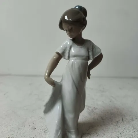 "HOW PRETTY" PORCELAIN FIGURINE