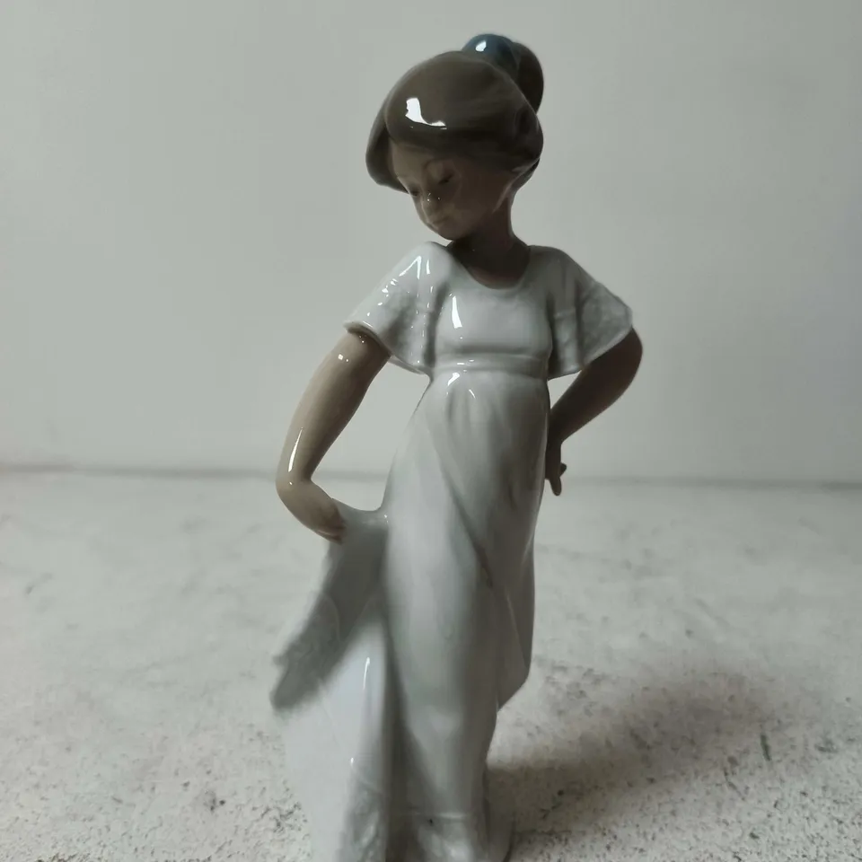 "HOW PRETTY" PORCELAIN FIGURINE