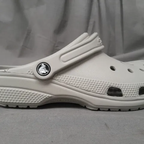 PAIR OF CROCS CLASSICS IN GREY UK SIZE M6/W7