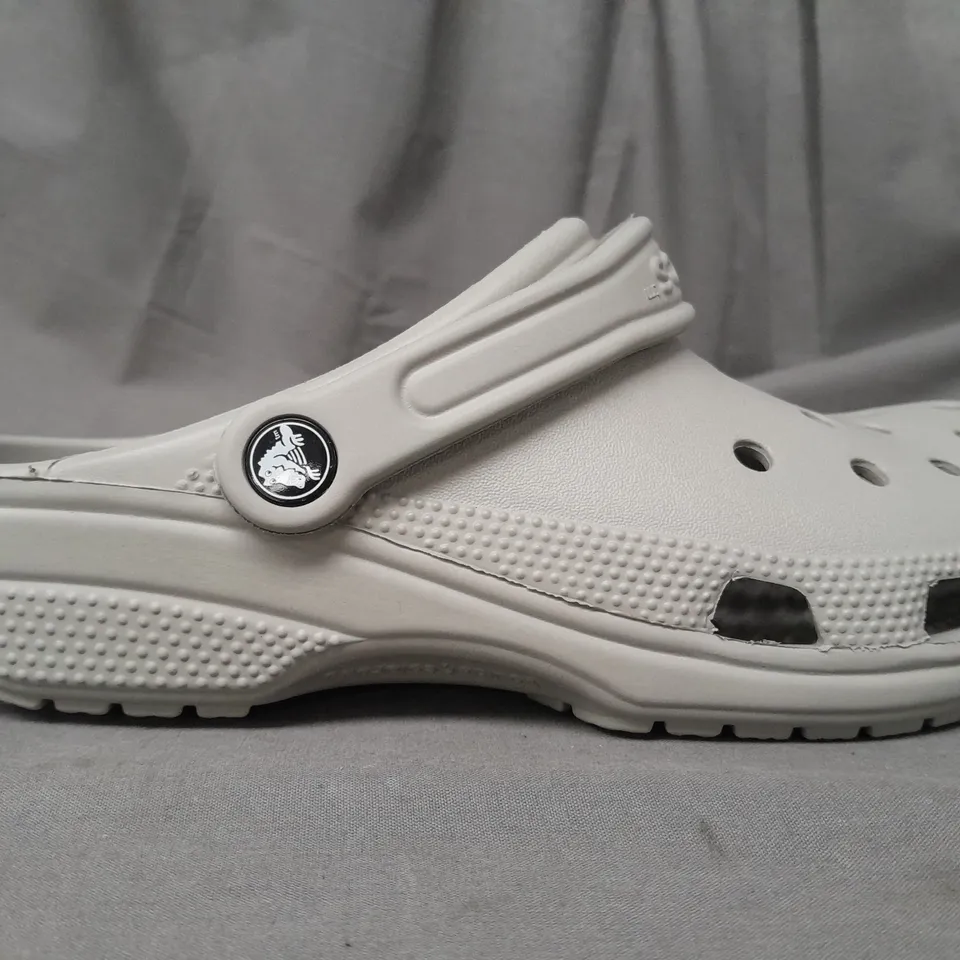 PAIR OF CROCS CLASSICS IN GREY UK SIZE M6/W7