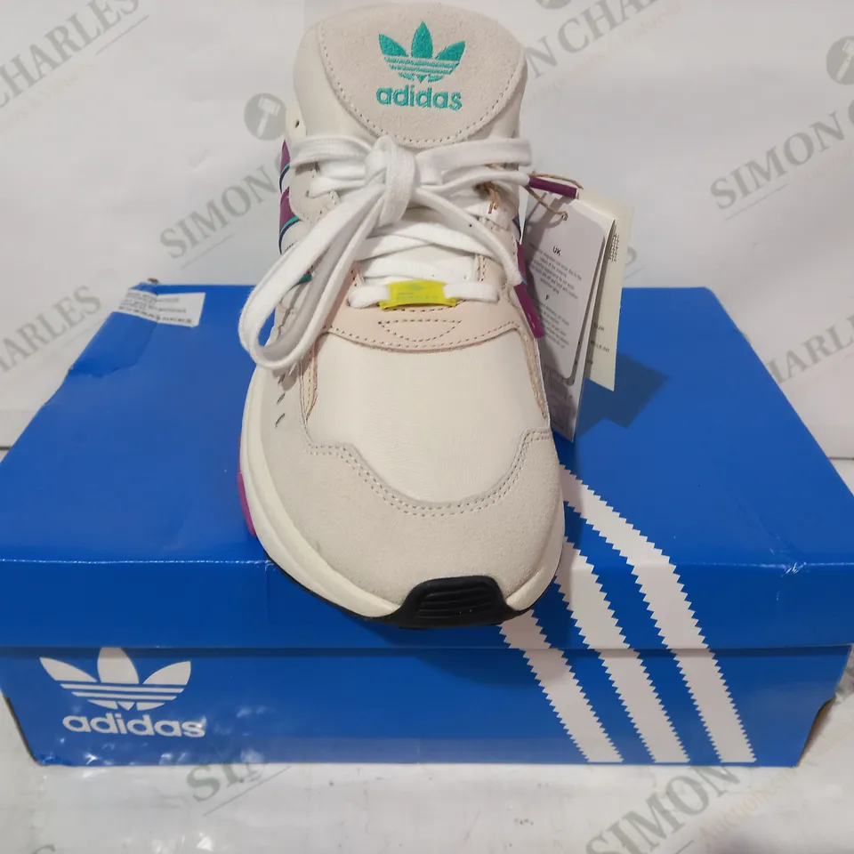 BOXED PAIR OF ADIDAS RETROPY F90 TRAINERS IN OFF WHITE/PURPLE/GREEN UK SIZE 9