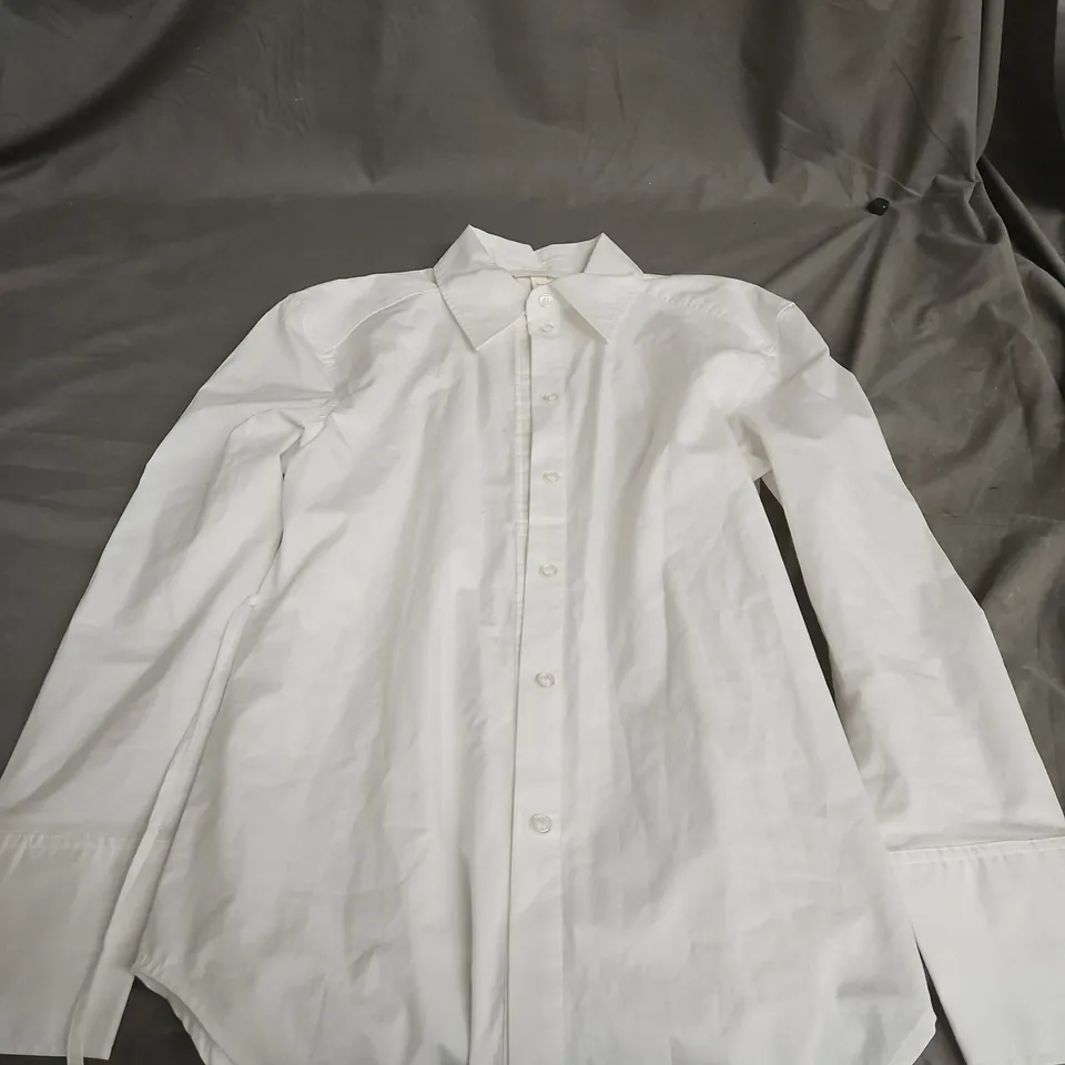 LARGE BOX OF ASSORTED CLOTHING ITEMS TO INCLUDE: COAT/S, SHIRTS.