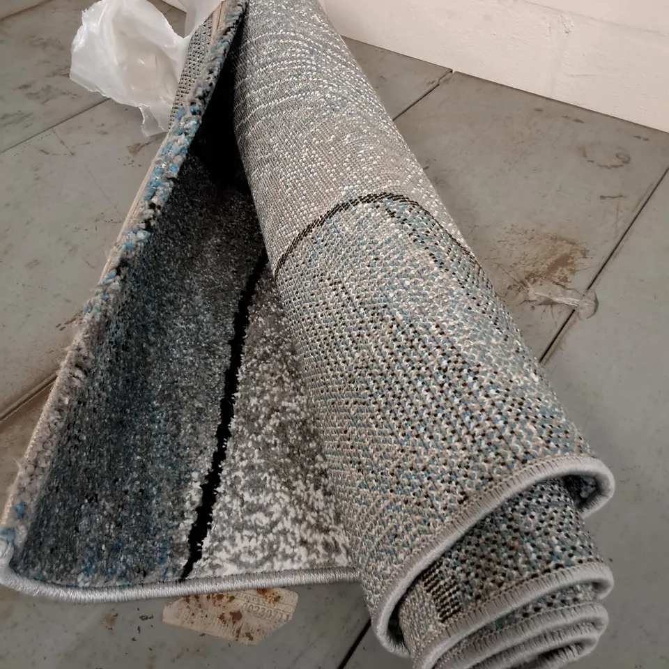 BRAND NEW ROLLED GREY/BLUE PATTERNED RUG - APPROXIMATELY 75CM X ?