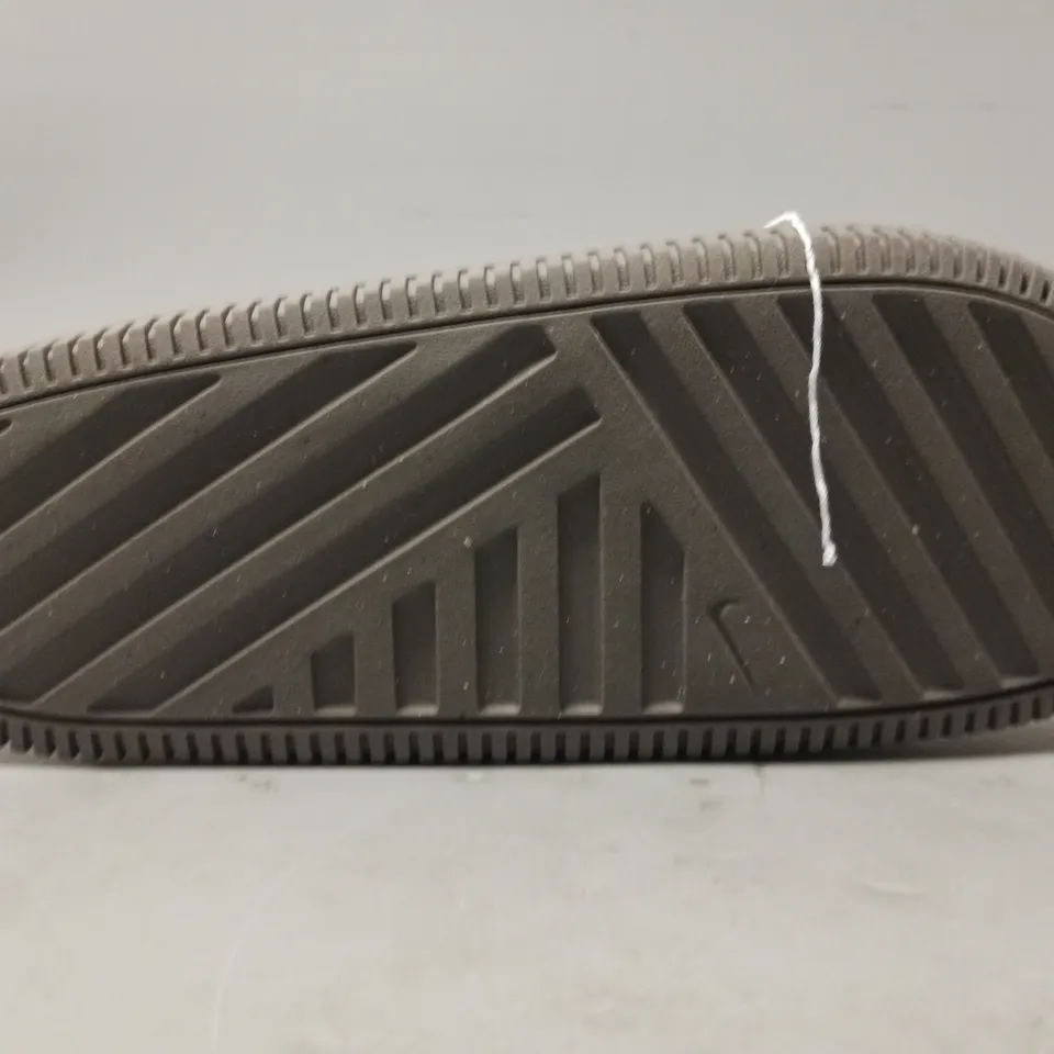 PAIR OF NIKE CALM SLIDERS IN GREY UK SIZE M8/W7.5