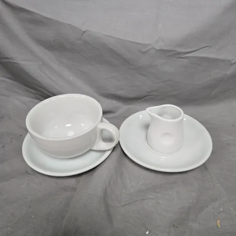 TOTE OF APPROXIMATELY 10 POTTERY ITEMS TO INCLUDE A SMALL MILK JUG, MUGS AND SAUCERS