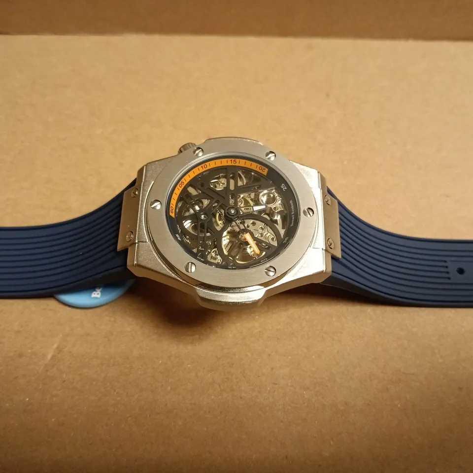BOXED BERNARD REINHARDT SKELETON WATCH – STAINLESS STEEL CASE, BLUE RUBBER STRAP