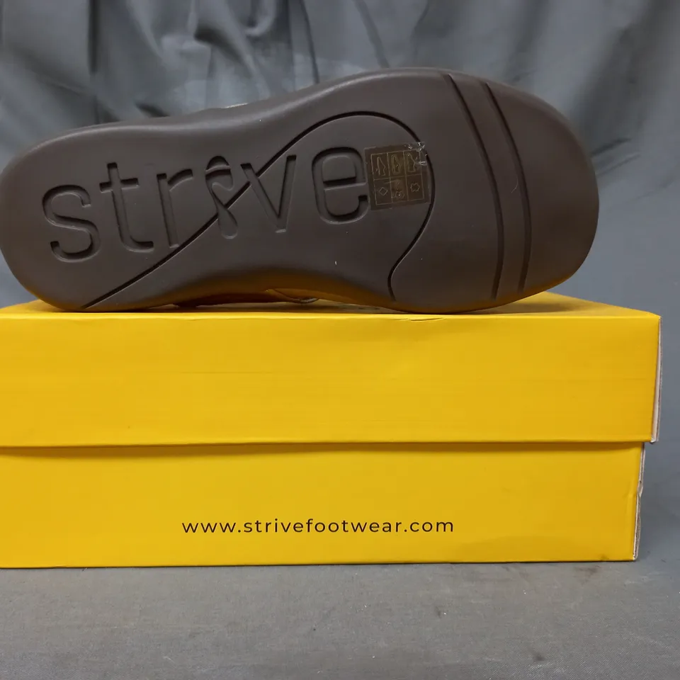 BOXED PAIR OF STRIVE SANDALS IN METALLIC GOLD SIZE 5