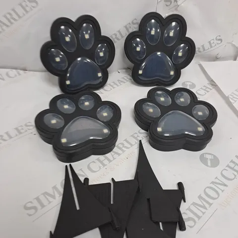 BELL AND HOWELL SET OF 4 SOLAR PAW LIGHTS