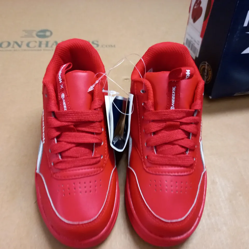 BOXED PAIR OF REEBOK COUT LOW HEELEYS IN RED - UK 12