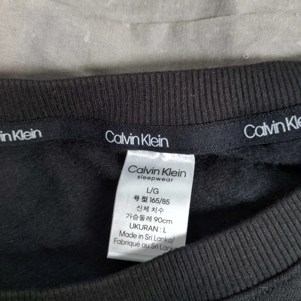 CALVIN KLEIN SLEEPWEAR BLACK LONG-SLEEVE TOP – UK SIZE L (MADE IN SRI LANKA)