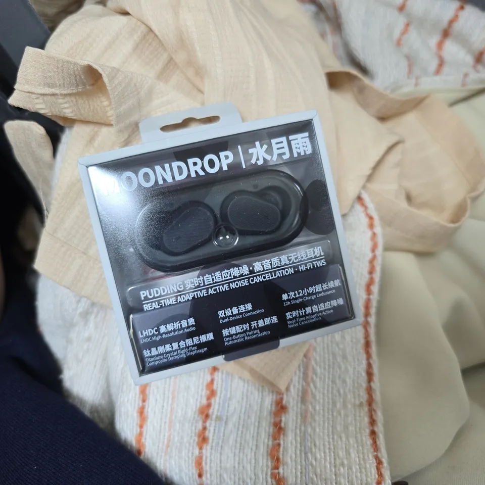 PALLET OF ASSORTED HOUSEHOLD AND CLOTHING ITEMS TO INCLUDE ROLLED RUGS, MOONDROP TWS EARBUDS, TOILET TISSUE MULTI-PACK AND VARIOUS CLOTHING ITEMS