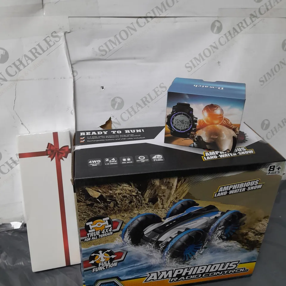 BOX OF ASSORTED ITEMS TO INCLUDE - AMPHINIOUS CAR - D-WATCH - MEEBUTY 