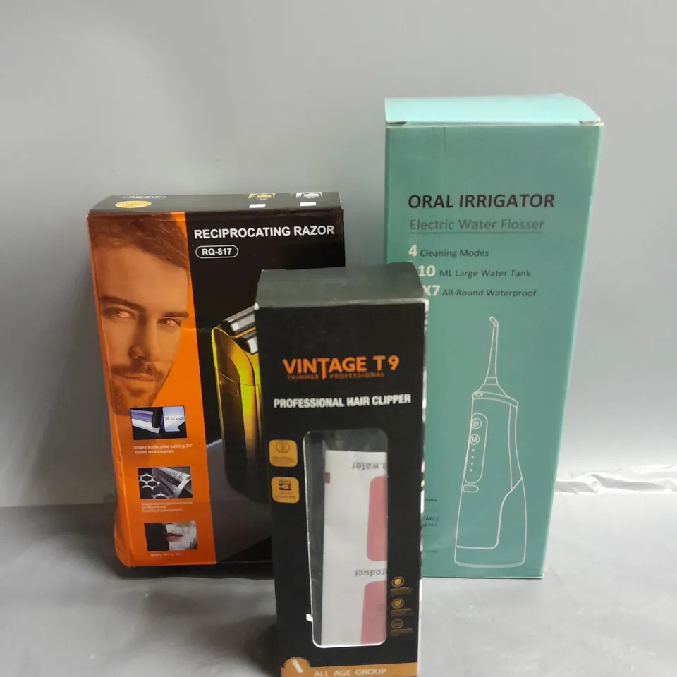 BOXED LOT OF 3 ELECTRICAL COSMETIC PRODUCTS TO INCLUDE - ELECTRIC WATER FLOSSER - VINTAGE T9 HAIR CLIPPER - RECIPROCATING FACIAL RAZOR