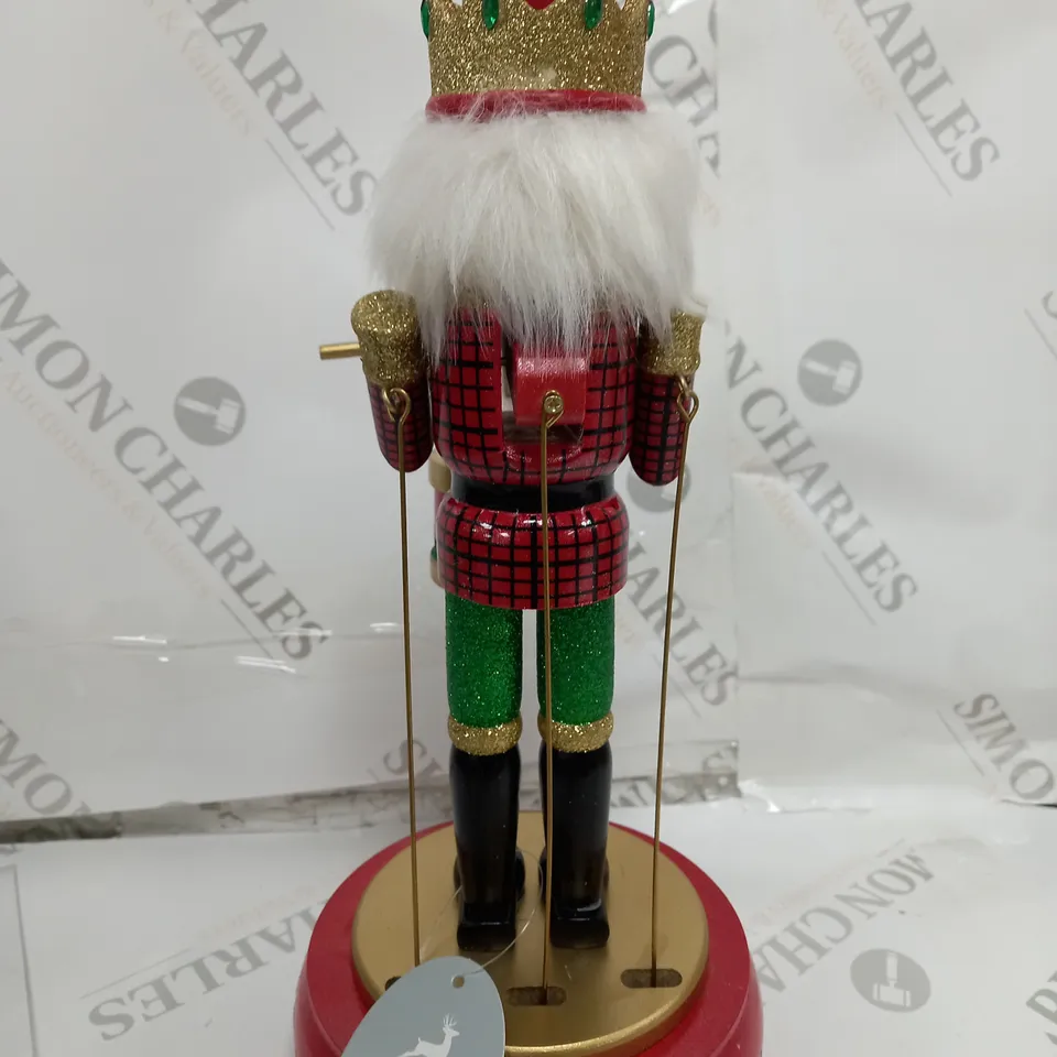 FESTIVE 32CM WOODEN ANIMATED MUSICAL NUTCRACKER