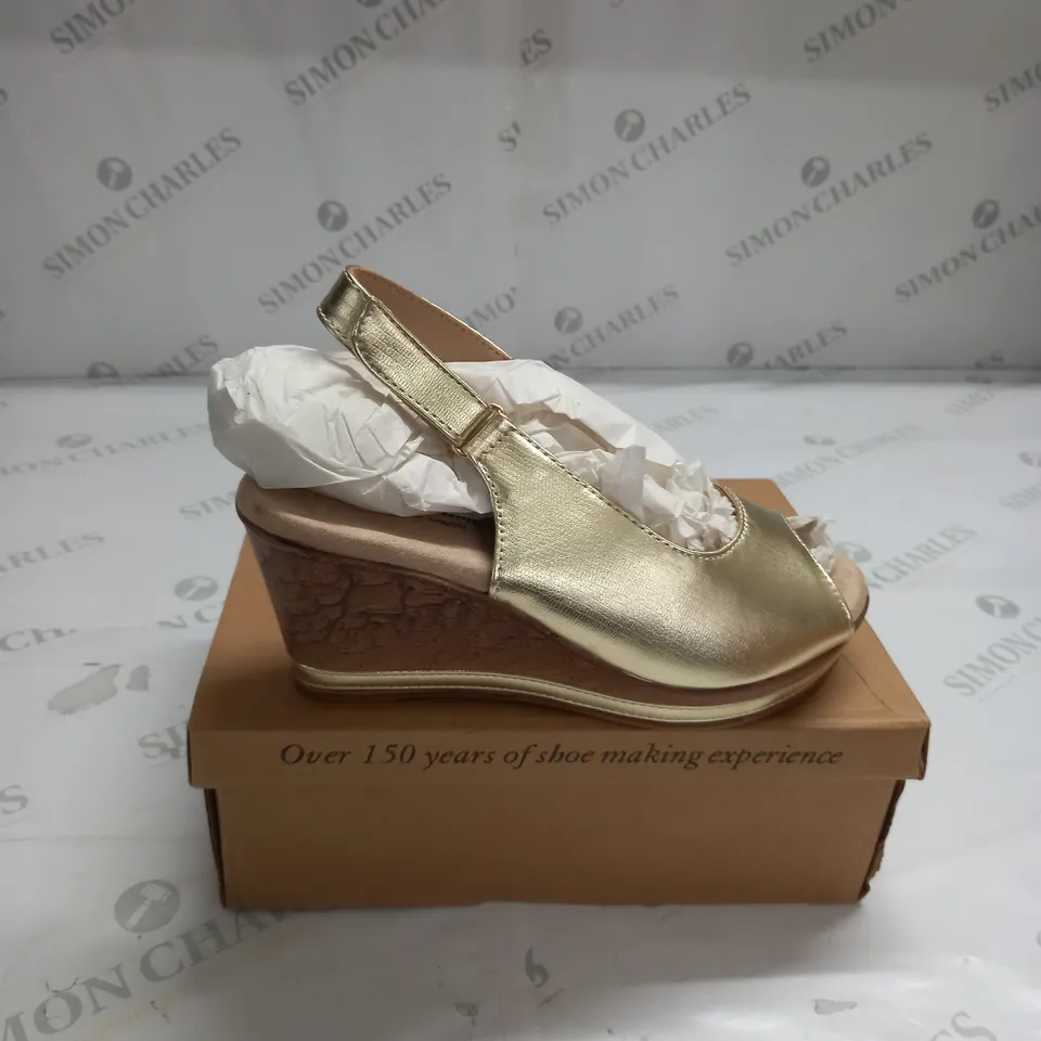 BOXED PAIR OF CUSHION WALK GOLD WEDGE HEEL SHOES IN GOLD - SIZE 5