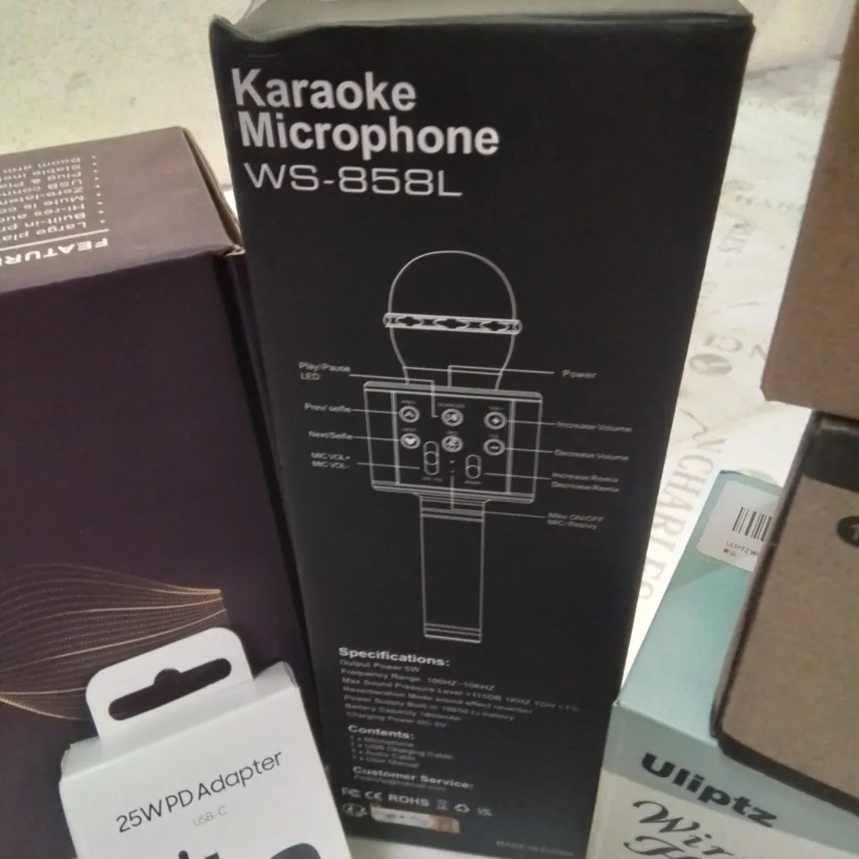 BOX CONTAINING LARGE AMOUNT OF BOXED ELECTRICAL ITEMS TO INCLUDE: PHONE CASES, HEADPHONES, LIGHT BULBS, PREMIUM PODCAST SET UP, KARAOKE MIC AND LOTS MORE.